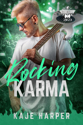 Cover - Rocking Karma by Kaje Harper - Handsome white blond man in his thirties with shaved side of his head and graying stubble, wearing mirrored sunglasses and a black stud in his ear, looking to the side and down, in a white t-shirt holding an electric guitar over his shoulder, green concert crownd background