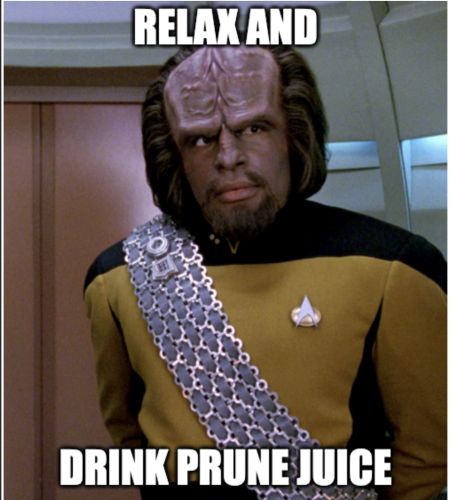 Image from TNG. Worf standing with caption that reads "Relax and Drink Prune Juice"