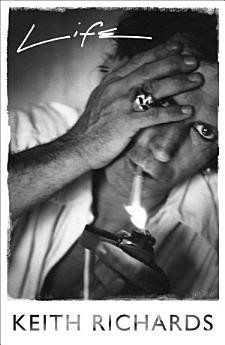 Image of the book cover for Life by Keith Richards. Has a black and white image of Keith, with his hand over one eye, showing the skull ring he wears. He's got a cigarette in his mouth and an old metal cigarette lighter in the other hand, with a flame touching the end of the cigarette. The image of Keith is leaning slightly, he's wearing a white shirt, and looking unsmiling and intense.

The book title is at the top, his name under the image which has a frayed edge all the way around it.