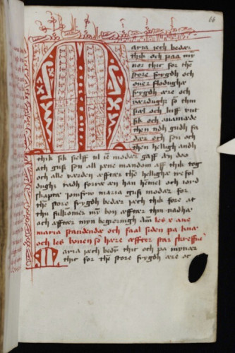 A very large red M in the top left corner of a page of a medieval Danish prayer book
