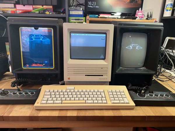 two vectrex with a classic macintosh in between