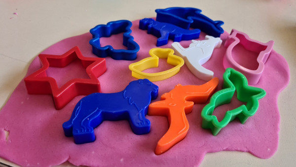 Its a writing metaphor. One giant blog of play-dough, every possible shape cutter stuck into it. Play-dough is cookie pink.