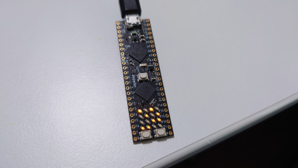 A small circuit board with some LEDs lit