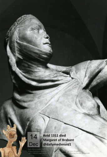 Black and white photography. Showing the torso and head of a damaged female statue. The right arm is broken off below the shoulder.