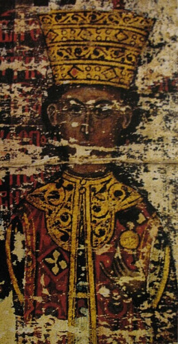 An illustration of Mara from a charter dated 1429. It is quite degraded, but it is a painted illustration in color. She gazes at the viewer directly. She wears golden robes and crown.