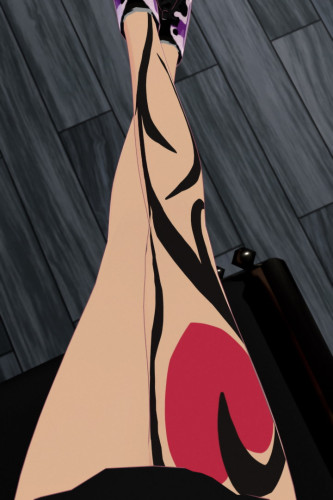 Lucy's legs crossed over eachother in the air, right leg on top. There's a tattoo on her right leg, of a vine-like design in black with a red heart attached to it near the top.