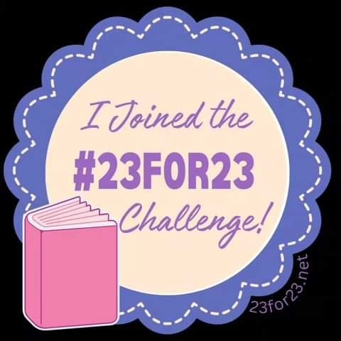 A purple seal next to a pink book that states I joined the #23for23 challenge