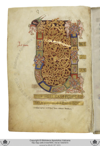 Full-page letter U from a medieval manuscript, with vine scrollwork in gold in the middle and coloured panels around the edge, with animal heads on the top of the strokes.
