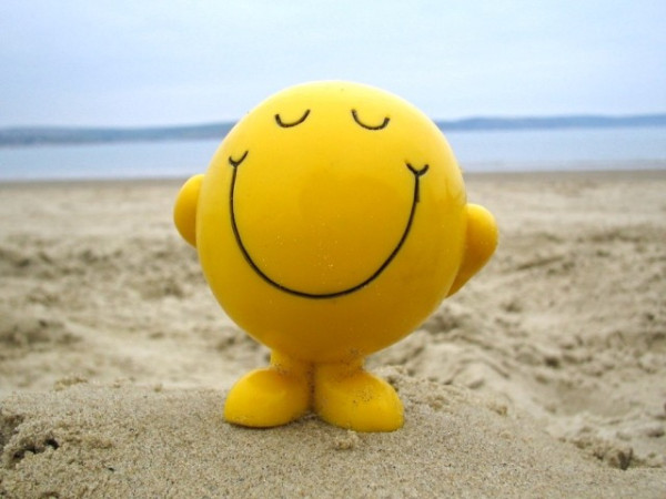 Smiley face on a beach.