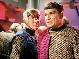 Romulans aboard a Romulan ship. One is wearing a helmet like the god Mercury. 