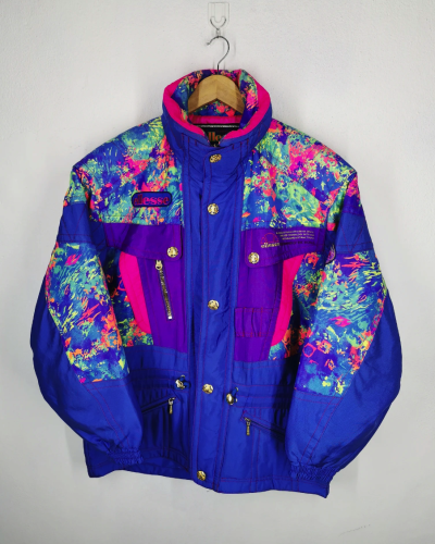 A 90s ski jacket in a riot of jewel tones with brass buttons. 