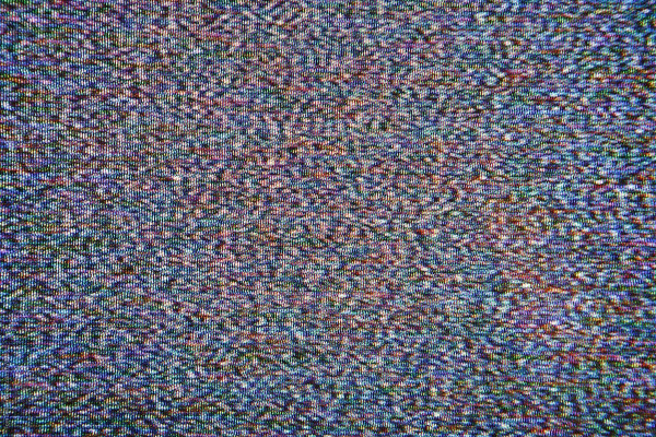 static and noise from an old TV screen, made up of tiny dots of colour that give the effect of movement