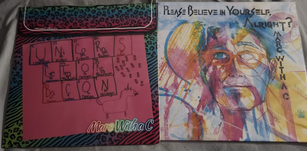 Two vinyl records, Unicorns get more bacon and Please believe in yourself, Alright? both by marc with a c
