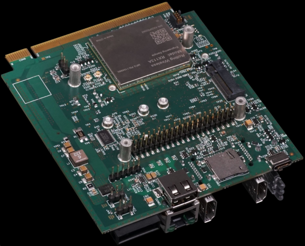 Picture of our V2X Node. A mainboard with electronics attached to it. Pins, A radio module etc.