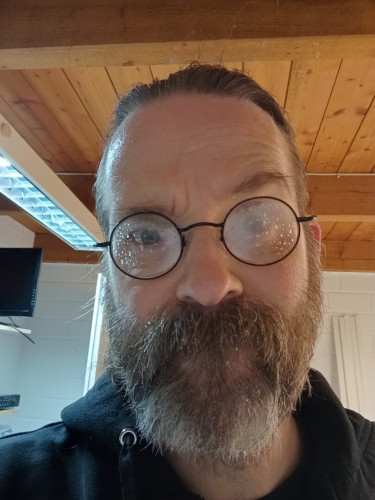 Selfie of bearded white man with foggy glasses