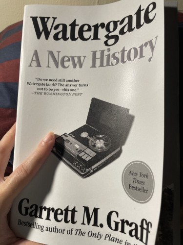 A paperback copy of Watergate: A New History by Garrett M Graff. It is white, title in black and grey, and has a tape recorder in greyscale