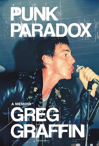 The book cover of Greg Graffin’s 2022 memoir. A young Greg is singing into a microphone, his lips frozen in mid-verse. He’s wearing a leather jacket adorned with pins and spikes, very punk rock-y. 