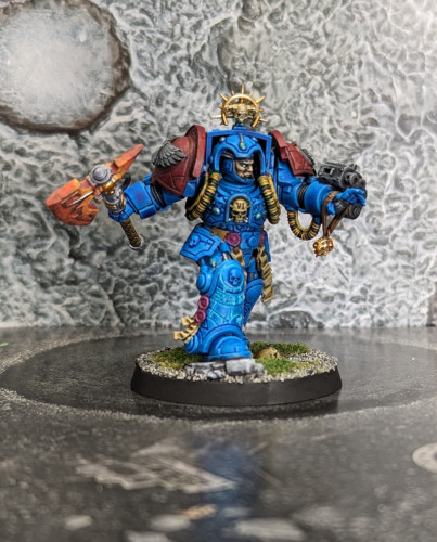 Warhammer 40k Space Marine Terminator Librarian mini painted with a Blood Angels color scheme. The new Terminator models are all really dynamic with a good sense of movement and intent.