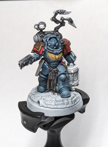 Warhammer 40k Space Marine Apothecary with some base colors and a very blue wash on what will become white armor.