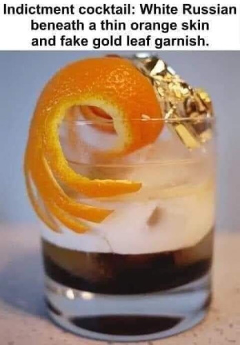 A cocktail with a description as a caption. Indictment cocktail: white Russian beneath a thin orange skin and fake gold leaf garnish.
