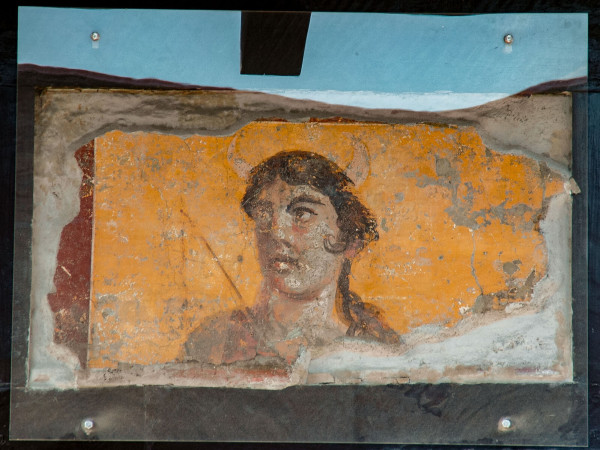 Fresco of Luna-Selene with lunar horns sprouting from her head against a yellow background.