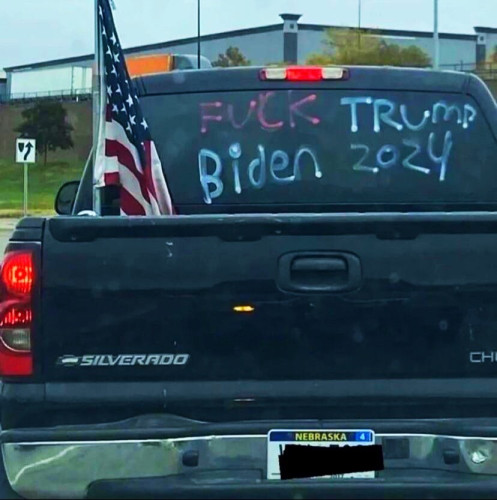 Poorly written political expression on truck. 