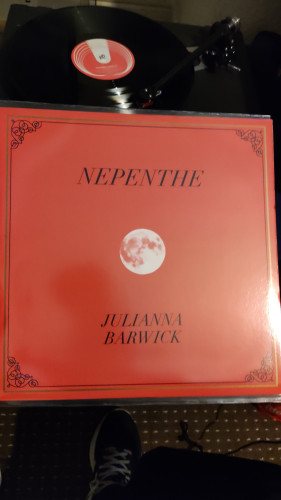 Vinyl cover in red with the moon in the centre 
