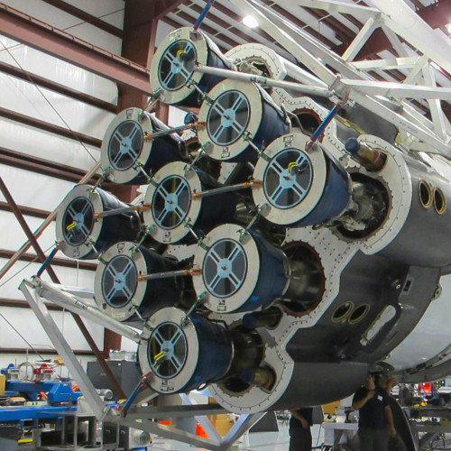 The SpaceX technical team are working on the thruster area of a rocket
