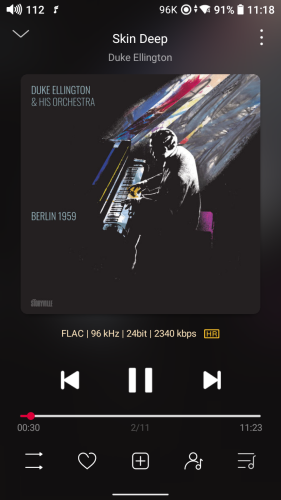 screenshot of HiRes audio player with Duke Ellington and His Orchestra - Berlin 1959 album cover. His is a painting with an all black background, Ellington is in the center, realism, with rainbow and grey waves flowing from him over to the upper right. 