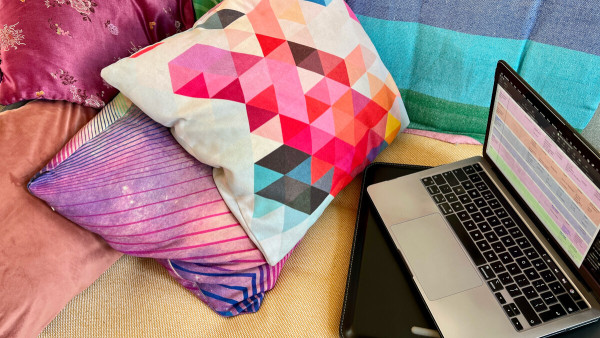 Laptop, cushions, sofa – this writer is taking the horizontal approach.
