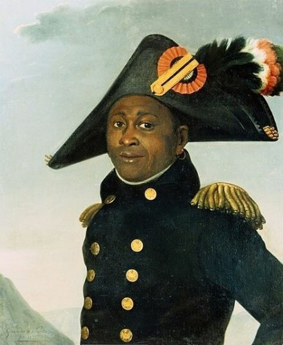 Posthumous 1813 painting of Louverture, wearing a double-breasted military coat and a 3-corner hat. By Alexandre-François-Louis, comte de Girardin - allposters.com, Public Domain, https://commons.wikimedia.org/w/index.php?curid=46545226