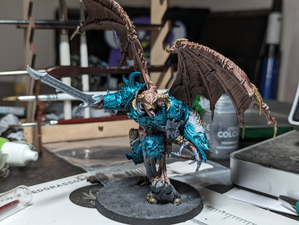 A Warhammer 40k Chaos Daemon Prince with wings and a sword and an attitude for days.