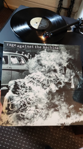 Rage Against the Machine viny cover of a monochrome car and fire 