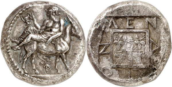 Ancient greek coin depicting Dionysus relaxing on the back of a donkey or goat, olding a chalice (presumably filled with wine.)