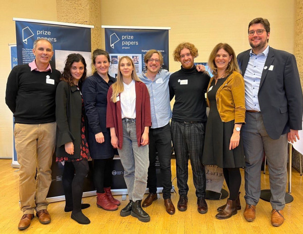 Group picture Prize Papers Project team (left to right): Mustapha Ousellam, Maria Cardamone, Gabrielle Robilliard-Witt, Lisa Magnin, Lucas Haasis, Oliver Finnegan, Dagmar Freist, Frank Marquardt, in the back: Prize Papers Project Stand at the Academies' Day in Berlin.