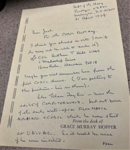Memorandum sheet of paper with handwritten note w/ blue ink by Grace Murray Hopper.  In print at the bottom is "From the desk of GRACE MURRAY HOPPER.  It is a 1969 note from Grace Hopper to Jack Jones, US Air Force on their CODASYL work & COBOL’s creation by her, Jean Sammet, Jones, +others. Hopper is suggesting important contributors, those at the '59 demo, to invite for the '69 COBOL 10th Anniv. Celeb. #GraceHopper #ComputerHistory #COBOL. Not pictured a few final words on the back and Hopper signing "Grace."