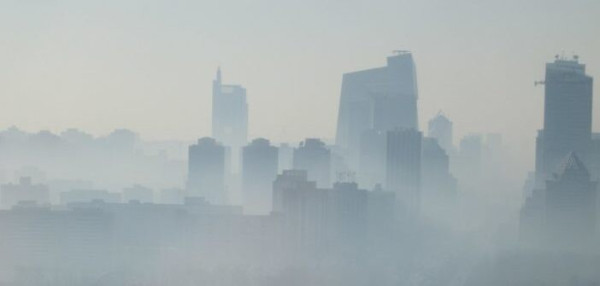 High-rise buildings in Beijing obscured by smog.