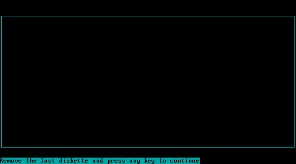 a black text console, with "Remove the last diskette and press any key to continue" on the bottom-left