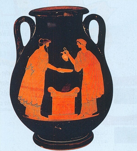 Photograph of a libation vase showing a scene with a burning altar with an adult, bearded man holding a libation bowl and a woman holding a jug to pour a libation into it over the fire of the altar between them.