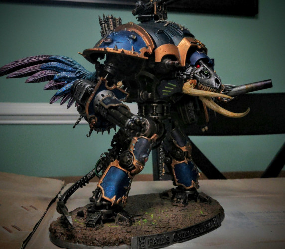 Chaos Knight Despoiler from Games Workshop.  Horned/tusked dinosaur skull replaces the Knight's head and iridescent bird wings flare out from the back of its chassis torso.