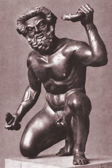 Bronze statue of a crouching satyr, holding two unidentified objects, one in each hand. He is kneeling on his right knee with the left one upright.