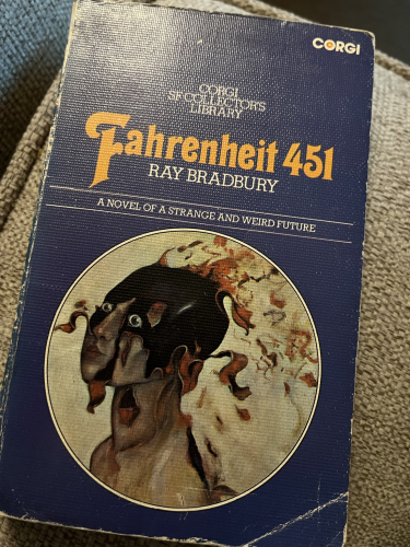 Cover of Fahrenheit 451 from the Corgi SF Collector’s Library with a figure staring out with flames curving from their skin.