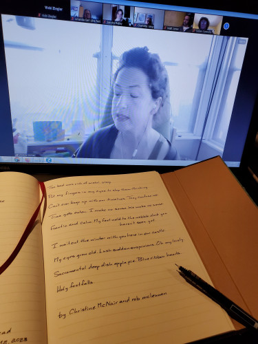 Poet Christine McNair on screen, in a zoom book launch for Amanda Earl's Beast Body Epic, reads from some of her own work. In the foreground, a handwritten transcription of some of McNair's poetry sits on the computer keyboard, with an uncapped pen resting on the notebook page.