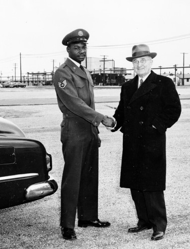 President Harry Truman, shaking hands with American airman Frank Singleton.