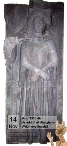 A gravestone with a reclining figure, a sword held at its neck