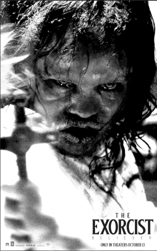 The poster for "The Exorcist: Believer". It's a black and white photo of one of the possessed girls holding a crucifix. Her eyes are discolored and her lips are dry and cracking