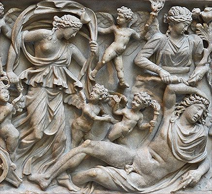 Roman marble sarcophagus, detail of Selene, Endymion, and several Erotes (Loves). Selene is wearing her iconic billowing cloak. Endymion is fast asleep while the Erotes are carrying the torches with which they light love and desire in the hearts of gods and mortals alike.