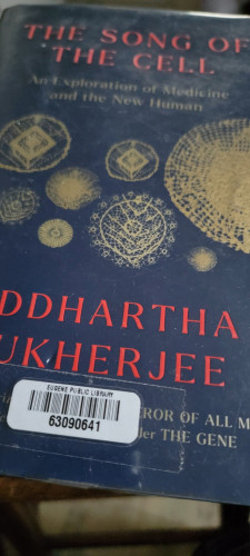 Book cover, The Song of the Cell by Siddhartha Mukherjee, blue with geometric cellular images like golden snowflakes