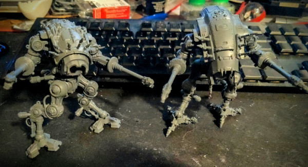 A pair of War Dog Executioner models from Games Workshop made from kitbashing together the Chaos War Dog & Imperial Armiger kits.