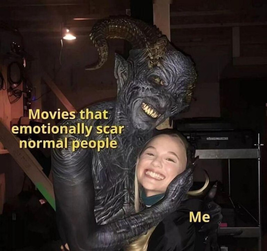 Picture of a demon hugging a young girl who is smiling widely. The text on the demon says "Movies that emotionally scar normal people" and the text on the young girl smiling says "Me"